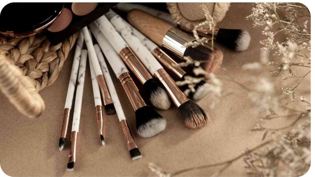 several makeup brushes laying on top of a wicker basket